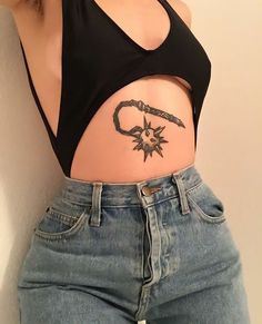 a woman with a tattoo on her stomach