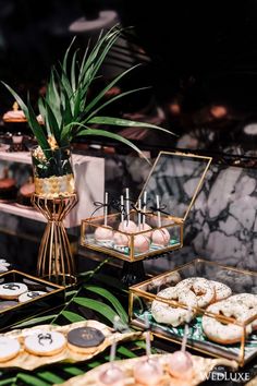 an assortment of donuts and pastries on display at a wedding or bridal party