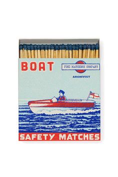 a matchbox with matches in the shape of a boat