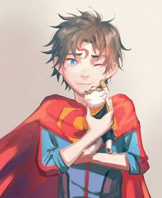 a man in a red cape holding a cupcake with his hands on his chest