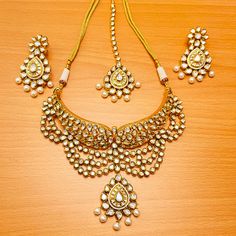 Exotic and snag-free kundan beaded necklace set with earrings. This is a stylish set with White Kundan. This set will work well with traditional, formal, and western formals. Option 1: Red Color (D657) Option 2: White Color (D709) Eye-catching and unique jewelry that will set you apart. Gift this piece to a loved one, and see their face light up with joy. Best for gifting or for personal use, wear it to any occasion and become the spotlight. Bollywood Meenakari Jewelry Sets For Formal Occasions, Bollywood Style Meenakari Jewelry Set For Formal Occasions, Kundan Chandbali Temple Necklace For Formal Occasions, Kundan Chandbali Temple Necklace For Formal Events, Festive Kundan Temple Necklace For Formal Occasions, Formal Kundan Chandbali Temple Necklace, Formal Chandbali Kundan Necklace With Meenakari, Formal Kundan Temple Necklace For Festive Occasions, Formal Kundan Temple Necklace For Diwali