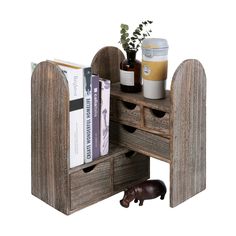 a wooden desk with drawers and books on it