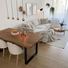 a living room filled with furniture and a wooden table