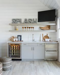 the kitchen is clean and ready to be used as a place for drinks or snacks