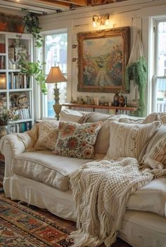 a living room filled with furniture and lots of windows