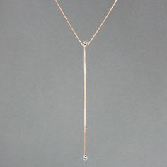 An architectural sliding lariat with 3mm stones at the top and bottom constructed with small and medium box chain. As an added feature, the necklace can be adjusted from 20 to 24 inches. - 5” long drop- High polish- Lobster clasp closureSequence Collection Formal Box Chain Lariat Necklace, Formal Lariat Necklace With Box Chain, Elegant Lariat Necklace With Box Chain, Modern Long Drop Box Chain Jewelry, Timeless Lariat Necklace With Adjustable Long Drop Chain, Timeless Long Drop Lariat Necklace With Adjustable Chain, Modern Long Drop Lariat Necklace For Formal Occasions, Modern Lariat Drop Necklace With Adjustable Chain, Modern Lariat Necklace With Delicate Chain