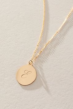 Just as effortless as it is elegant, this stunning necklace features an oval pendant with gorgeous cursive engraved initial for the ideal finishing touch. * 14k Gold Filled chain * Personalized, laser engraved, 14k Gold Filled 17x22mm oval pendant * Length: 20" * 5 days of production | Set & Stones Personalized Amelia Necklace at Free People in Gold Elegant Engraved Charm Necklaces For Formal Occasions, Elegant Engraved Charm Necklaces For Anniversary, Elegant Yellow Gold Engraved Charm Necklaces, Elegant Engraved White Gold Charm Necklaces, Elegant White Gold Initial Necklace For Personalized Gift, Elegant Engraved Charm Necklace For Anniversary, Elegant White Gold Initial Necklace As Personalized Gift, Elegant Engraved Charm Necklace With Round Pendant, Elegant Round Engraved Charm Necklaces