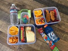 two plastic containers filled with food on top of a wooden table next to a water bottle