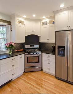 Paint Kitchen - white painted kitchen cabinets with honed granite countertop, stacked cabinetry, stainless steel appliances, farm sink #kitchen #whitekitchen #whitekitchencabinets #stainlesssteelappliances #homerenovation #dreamkitchens Small Kitchen With Corner Stove, Stove In The Corner Of The Kitchen, Sink Next To Stove Kitchen, Stove In Corner Of Kitchen, Corner Range Kitchen Layout, Corner Stove Kitchen Layout, Honed Granite, Corner Sink Kitchen