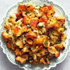 a white bowl filled with food on top of a table