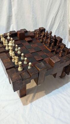 a chess board made out of wooden pieces