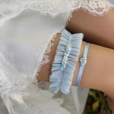 The elegant wedding garter for bride in a delicate blue color will add that extra special "something blue" touch to your Wedding Day! An adorable but simple ruffled tulle garter with pearl wavy embellishment in the middle and manually sewn seed beads is a great tiny accent to elevate and complete your Wedding outfit. All our elegant thigh garters for wedding are handmade with attention to details, to bring you the best experience and convenience on your Special Day! Choose the amount of leg garters - only wide bridal garter, only soft toss garter, or the set of both - in the drop-down window. 🤍Width of the keepsake thigh garter - 2in/5cm Width of the slim throw garter - 0.4in/1cm 🤍Please, provide us with your thigh measurement in the personalization window when ordering - according to th Tulle Garter, Garter For Wedding, Thigh Garters, Thigh Garter, Bride Elegant, Wedding Garter Blue, Something Blue Wedding, Fancy Wedding, Bridal Garter