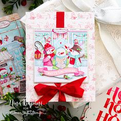 three christmas cards with red bows on them