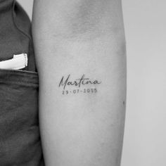 a woman's arm with a tattoo that reads, martinia 19 01 - 2013