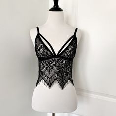 Black Strappy Eyelash Lace Bralette Brand New, Never Used But Cut Off The Tags And Labels Size Fits A Small/ 32a Or B Similar To For Love & Lemons Black Lace Tops With Delicate Straps, Black Lace Party Camisole, Black Lace Bra-friendly Camisole, Black Lace Camisole For Night Out, Black Strappy Bra For Night Out, Lace Camisole Bra For Night Out, Party Camisole Bra With Delicate Straps, Black Underwire Camisole For Party, Black Fitted Bra With Spaghetti Straps