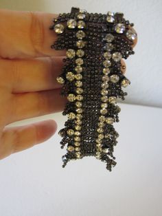 SWAROVSKI STRETCH BRACELET This bracelet is simply elegant! Made of a zillion tiny steel gray beads and gorgeous sparkling prong set rhinestones. 7 inch bracelet with some stretch. It feels like lace fringe. So perfect for any dressy occasion. In excellent vintage condition! Would make a beautiful gift. Silver Sparkling Beaded Bracelets For Party, Sparkling Silver Beaded Bracelets For Party, Metal Beaded Bracelets With Bling For Party, Elegant Rhinestone Stretch Bracelet For Party, Party Stretch Bracelet With Rhinestones, Silver Beaded Bracelets With Sparkling Stones For Party, Elegant Beaded Stretch Bracelet For Parties, Elegant Sparkling Beaded Bracelets For Party, Vero Beach Fl