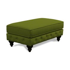 a green ottoman sitting on top of a white floor