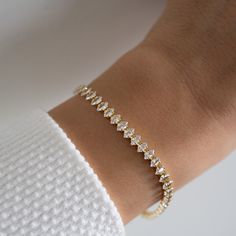 "Marquise shaped stones adorn this beautiful tennis bracelet! Such a classic and stunning piece that is great for stacking, dressing up, or simply on its own! - - - D E T A I L S - - - ▪︎ We use a Thick plating of 14k Gold or Rhodium over brass - for a piece that will be with you for years to come! ▪︎ Available in Sizes: 6.25\", 6.75\" or 7\" + .5\" Ext ▪︎ Stones measure at about 5mm ▪︎ Lobster Clasp Closure ▪︎ Nickel-free, lead free and hypoallergenic ▪︎ Highest Grade CZ for an authentic diamond look  BRACELETS ON MODEL: Chain Bracelet https://www.etsy.com/listing/1388390032/gold-bracelet-chain-bracelet-dainty?click_key=65f0211ef9e4432039629fae99d5170de87ae4c3%3A1388390032&click_sum=7ded955e&ref=shop_home_active_27&pro=1&sts=1 Emerald Bracelet https://www.etsy.com/listing/1378266370/emera Daily Wear Jewellery, Bracelet For Her, Bracelet Tennis, Emerald Bracelet, Gold Armband, White Bracelets, Wedding Jewelry Bracelets, Marquise Cut Diamond, Minimalist Bracelet