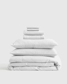 white pillows stacked on top of each other