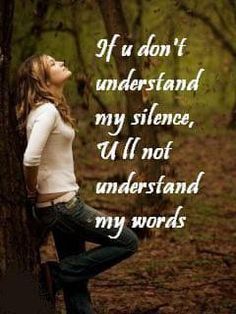 a woman standing next to a tree with her head up in the air and texting if u don't understand my silence, i'll'm not understand my words