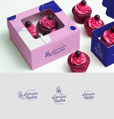 three cupcakes with pink frosting in a box