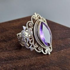 Handmade Bohemian / Art Deco Amethyst Ring Set on 925 Sterling Silver.  Size 8 This Art Deco inspired Amethyst ring featurss great details of ornamental lines. The amethyst in fiery and a beautiful light purple in color. The ring is in good used condition with some minor wears. Please see photos for details. Bohemian Silver Amethyst Ring, Silver Bohemian Amethyst Rings, Ornate Sterling Silver Amethyst Gemstone Ring, Bohemian Amethyst Crystal Ring In Silver, Ornate Sterling Silver Amethyst Ring, Bohemian Amethyst Ring As Gift, Bohemian Amethyst Ring, Bohemian Silver Amethyst Ring In Sterling Silver, Silver Amethyst Bohemian Ring