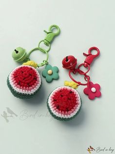 two crocheted keychains are sitting next to each other