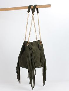 This beautiful and useful genuine leather bucket bag is made of high quality in GREEN natural genuine SUEDE leather. This bag is one of our classics, it sits beautifully, and carries everything you need! The bucket bag is lined with natural linen. It has one interior pocket with zipper, this bag keeps your hectic day organized and can fit a phone, keys, cosmetic bag as well as many accessories. This bag is fit and stylish for women's work and everyday concept. All items are made by hand with love for quality materials, fine workmanship, and clean design.  This leather bucket bag is closed by a magnet closure. This bag is functional with its chain bag strap. You can both use as a shoulder bag and crossbody bag. It has fringe details. Product size (approx): * Width 15.5 cm  * Height 23 cm  * Women Work Bag, Leather Work Bag, Blue Leather Bag, Mini Bucket Bags, Mini Bucket, Vegan Leather Bag, Handbag Women, Leather Bucket Bag, Leather Bucket