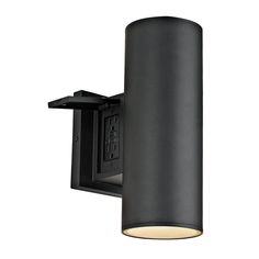 a black light fixture on a white wall