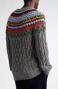 Channel classic après-ski style with this cozy sweater knit in chunky cable stitches from virgin-wool yarn and ringed with a colorful Fair Isle pattern. Crewneck Long sleeves Dropped shoulders Ribbed cuffs and hem 100% virgin wool with 73% wool, 21% alpaca, 6% nylon yoke Dry clean Made in Italy Designer Clothing Gray Fair Isle Winter Outerwear, Gray Fair Isle Sweater For Cold Weather, Merino Wool Fair Isle Pattern Long Sleeve Outerwear, Gray Fair Isle Sweater, Fair Isle Merino Wool Long Sleeve Outerwear, Moncler Sweater, Apres Ski Style, Ski Style, Carpenter Pants