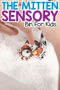 the mitten sensory bin for kids is being held by someone's hand