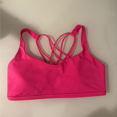 Never Worn Without Tags, Perfect Condition, “Highlighter Pink” Color, Reflective Back Logo, With Padding Pink Sports Bra For Pilates In Spring, Pink Yoga Sports Bra With Adjustable Straps, Pink Adjustable Straps Sports Bra For Yoga, Summer Pink Sports Bra For Pilates, Summer Pilates Sports Bra In Pink, Pink Sports Bra For Pilates In Summer, Spring Strappy Sports Bra For Yoga, Strappy Sports Bra For Yoga Spring Season, Spring Yoga Sports Bra With Strappy Design