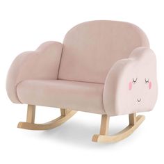 a pink rocking chair with a face drawn on it