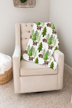 a baby's chair with a blanket on it in the corner of a room