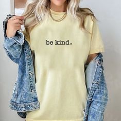 💛 Spread Kindness Everywhere You Go! 💛Introducing our new "Be Kind" shirt in a cheerful yellow, featuring a small heart to remind us all that kindness matters. 🌼💖 Perfect for brightening up someone's day and sharing a positive message. Let's make the world a kinder place, one shirt at a time! 😊 🔸 Soft and comfortable🔸 Available in all Comfort Color brand sizes🔸 Get yours now and wear a little kindness! #BeKind #SpreadLove #BootsandRootsApparel #BootsandRootsApparelCo #momprenuer #graphic Be Kind Shirt, Kindness Shirt, Lake Girl, Blank Apparel, Kindness Matters, Small Town Girl, Spread Kindness, Kindness Shirts, Comfort Color