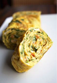 an omelet is cut in half on a plate