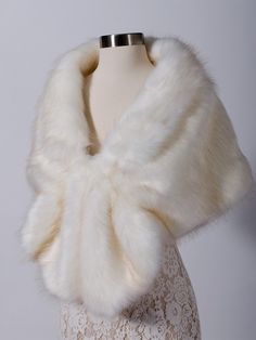 a white fur collar on a mannequin