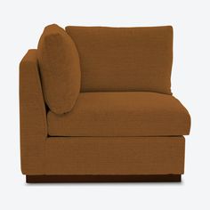 a brown couch sitting on top of a white floor