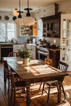 a wooden table sitting in the middle of a kitchen