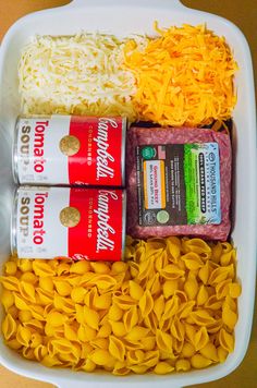 pasta, meat and cheese are arranged in a container