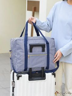 BirdinBag - Stylish Foldable Striped Travel Bag - Spacious, Fashionable, & Efficient Storage Solution Blue And White Pattern, Efficient Storage, Handle Bag, Storage Solution, White Patterns, Travel Bag, Storage Solutions, Color Blue, Stripes