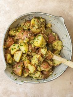 cooked potatoes with herbs and seasoning in a bowl