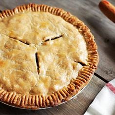 a pie sitting on top of a wooden table