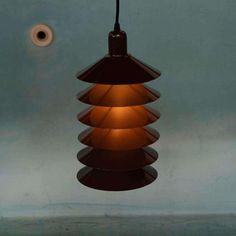 Space age cylindrical metal hanging lamp, designed by Jørgen Gammelgaard in the 1970s for the Danish brand Fog & Mørup, model TipTop. with its compact diameter, this lamp is ideal for small spaces such as the hall, the toilet, or as atmospheric lighting in the baby or children's room. Also beautiful as accent lighting in the corner of the living room. This deep brown hanging lamp, also called a bowl lamp, consists of several bowls with space in between, which ensures a soft, even light distribut Atmospheric Lighting, Ireland Homes, Accent Lighting, In The Corner, Deep Brown, Space Age, Hanging Lamp, Childrens Room, A Bowl