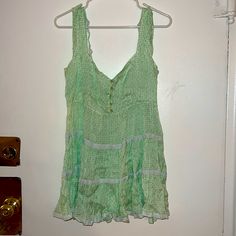 Never Work . Nwot Tags . Mini Dress With Key Lock Tie At Back . Size 10 . Concealed Side Zip On Left Side Green Lined Mini Dress For Vacation, Cute Lined Mini Dress For The Beach, Green Sundress With Ruffle Hem, Green Casual Sundress With Ruffles, Cute Green Mini Sundress, Cute Green V-neck Dress, Green Cotton Lined Mini Dress, Cute Fitted Green Sundress, Cute Green Mini Dress For Vacation