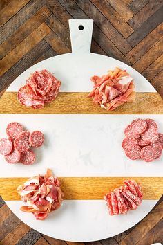 raw meats are on a cutting board ready to be cut into smaller pieces and serve as appetizers