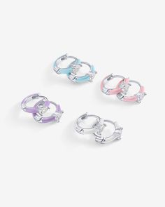 These colored enamel huggie earrings are the perfect accessory to elevate both day and evening looks. Whether you're going for trendy sophistication or a subtle hint of glam, these earrings have got you covered. Materials: 14K yellow or white gold plated. 925 sterling silver posts. AAAAA Cubic Zirconia. Blue, Pink, Purple or White Enamel. Measurements: Diameter: 10.8mm (.42"); Thickness: 2mm. Stone size: 3x4 mm. Blue Pink Purple, Pink Enamel, Huggie Earrings, Everyday Jewelry, White Enamel, Huggies Earrings, Geneva, Purple Gold, Jewelry Organization