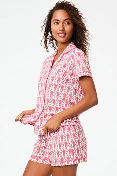 We love love love our matching top and bottom polo-style pajama sets! The cozy 100% Premium Cotton will make you happy that this pajamas-out-to-brunch trend is still happening. Button Front Closure Functional Breast Pocket Mid-Rise Elastic Waist Materials and Care 100% Long-Staple Premium Cotton Machine Wash Cold, With Like Colors Do Not Bleach, Tumble Dry Low (Line Dry Recommended) Imported Measurement Information Model Wears Size Small Size S Length: 25.5" (from Shoulder) Size S Sleeve Length: Playful Pink Matching Set Sleepwear, Cotton Sleepwear With Camp Collar For Loungewear, Playful Relaxed Fit Tops For Pajama Party, Pink Relaxed Fit Top For Bedtime, Playful Matching Set Top For Pajama Party, Playful Pink Sleepwear With Relaxed Fit, Playful Pink Relaxed Fit Sleepwear, Pink Matching Set Sleepwear For Lounging, Casual Matching Set Tops For Sleepover