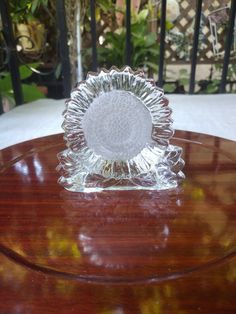 a glass dish sitting on top of a wooden table