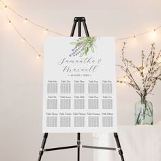 an easel with a wedding seating chart on it